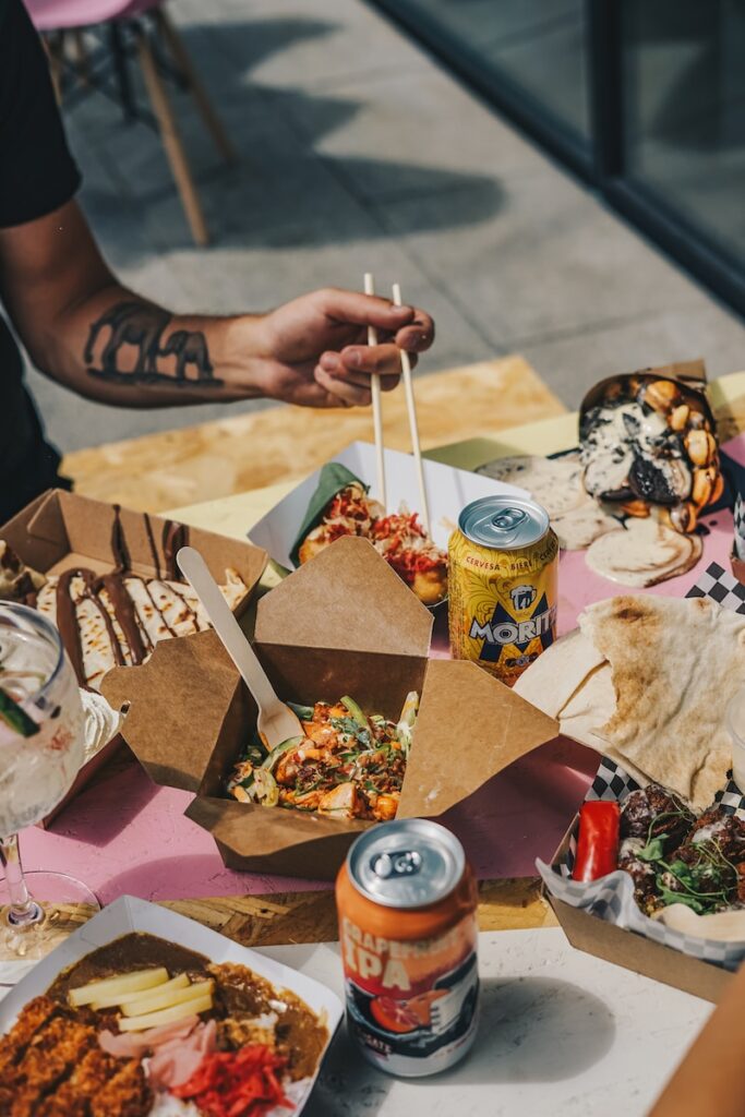 a table topped with lots of food and drinks