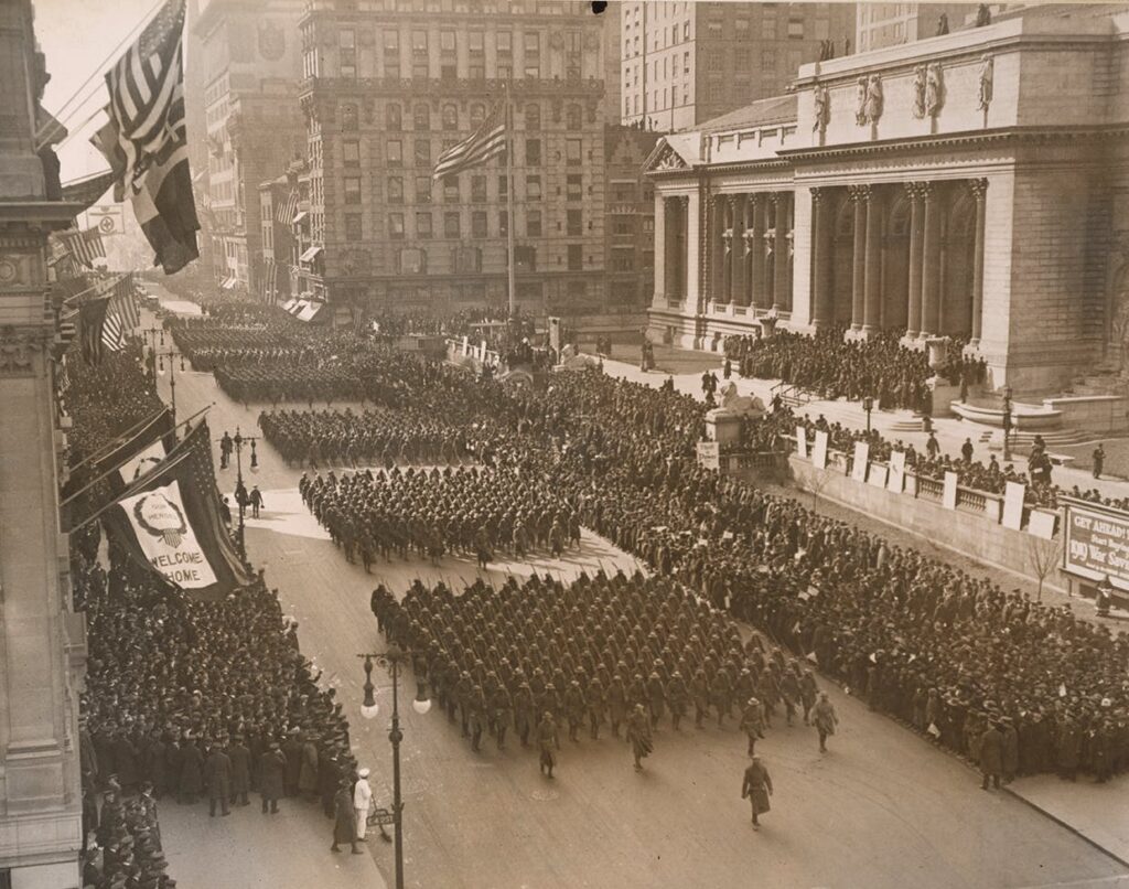 The all-Black 369th Division, or Harlem Hellfighters, return home to New York City for a victory parade after fighting valiantly in World War I, Feb. 18, 1919. Photo via National ArchivesForged in Crisis 