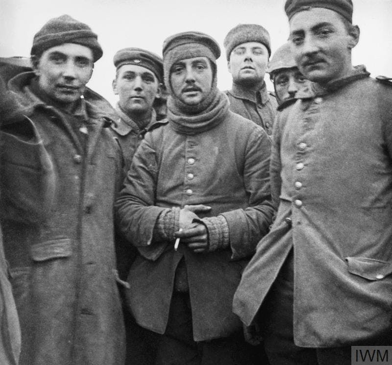 A snapshot taken by a British officer showing German and British troops fraternising on the Western Front during the Christmas Truce of 1914. © IWM (Q 11718)
