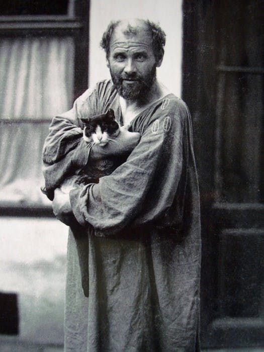 Gustav Klimt with his cat. He loved cats, but loved women more. 