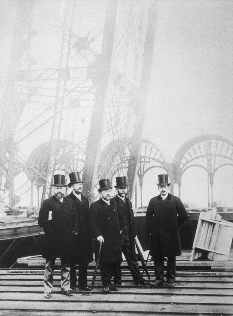Gustave Eiffel pictured in the middle surrounded by his team.
