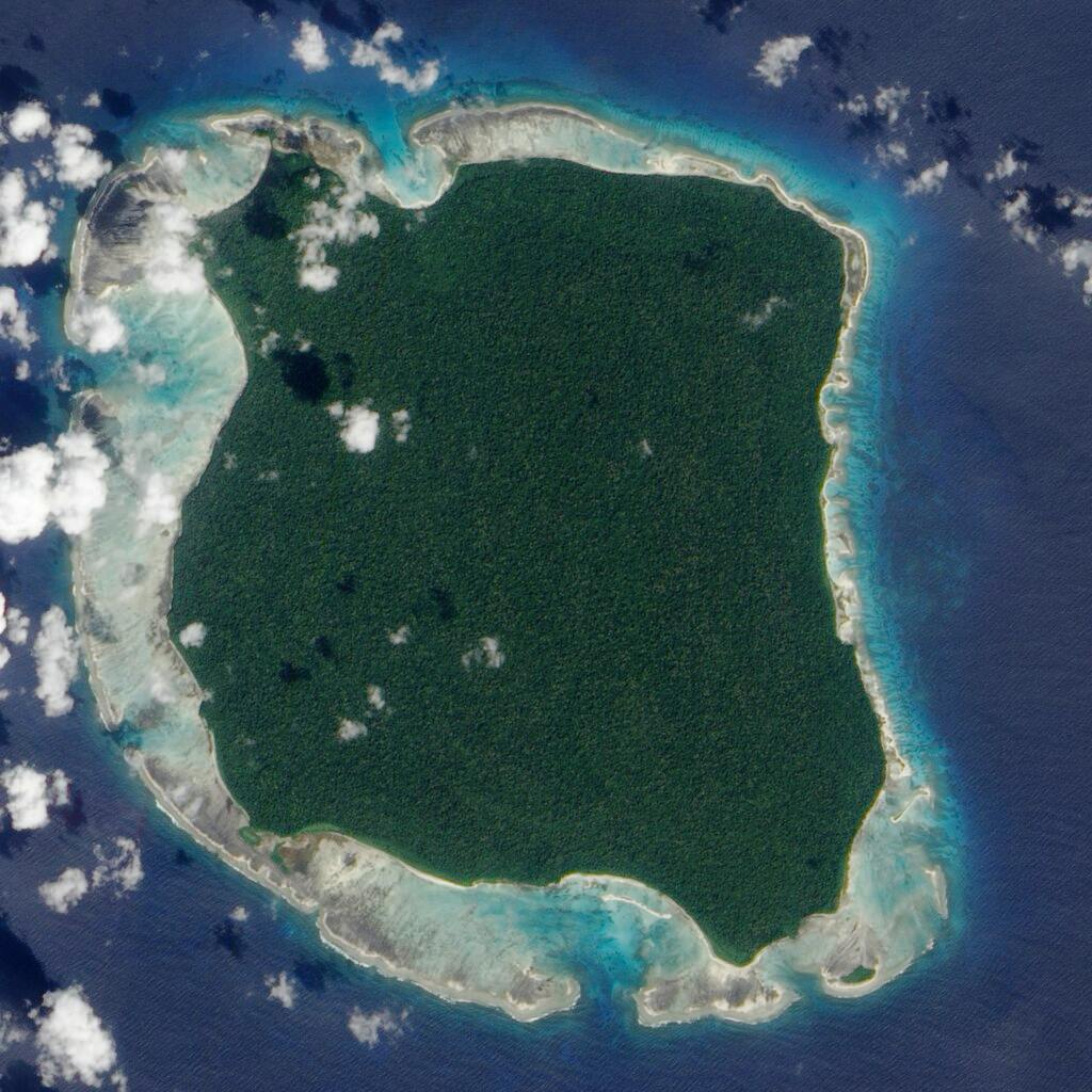 Sentinel Island surrounded by coral reefs as a natural barrier. A three mile long border 