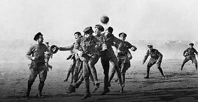 Soldiers playing soccer in No-Man's Land during the Christmas Truce in 1914.
