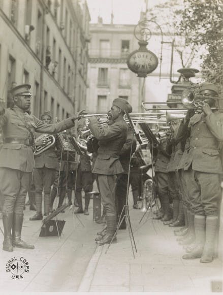 Genuine jazz for the yankee wounded In the courtyard of a Paris hospital for the American wounded, an American negro military band, led by Lt. James R. Europe, entertains the patients with real American jazz. Photo from Library of Congress.